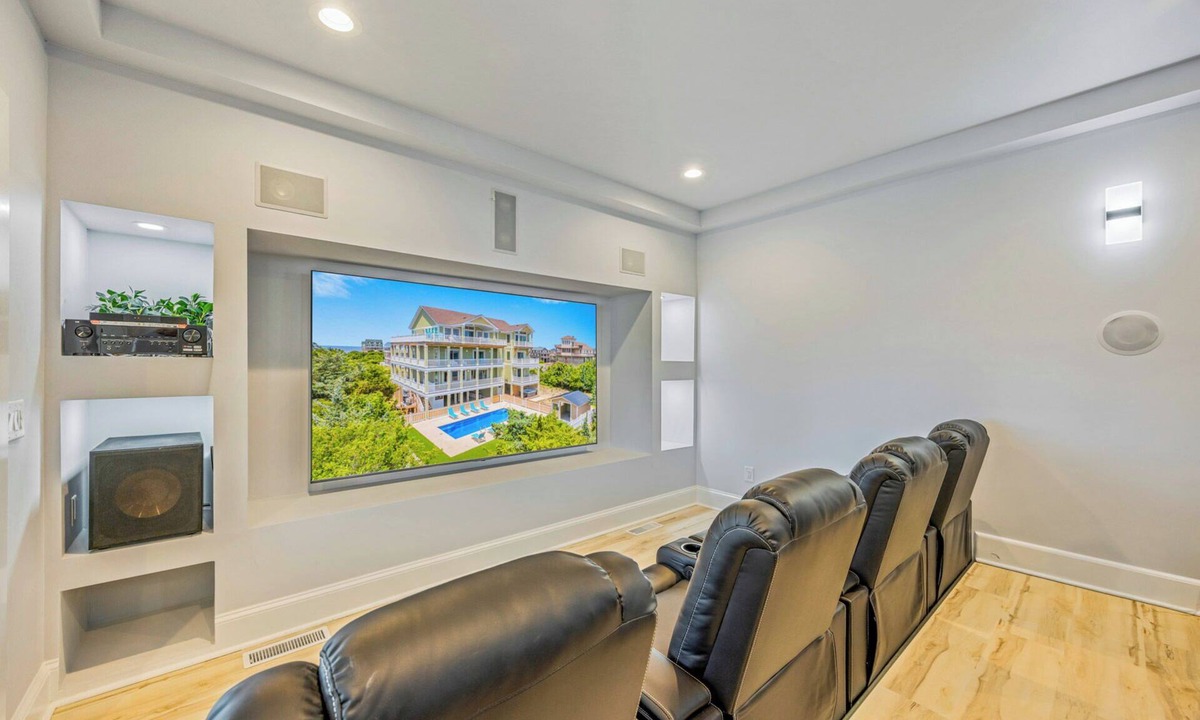 Wind Over Waves House | New Soundside Dog Friendly Avon Retreat with Pool, Hot Tub, Game Room, Theater