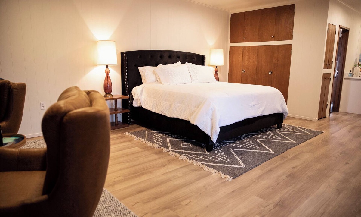 Cherokee Village Hotel | Suite 105 freatures a private outdoor-covered balcony.