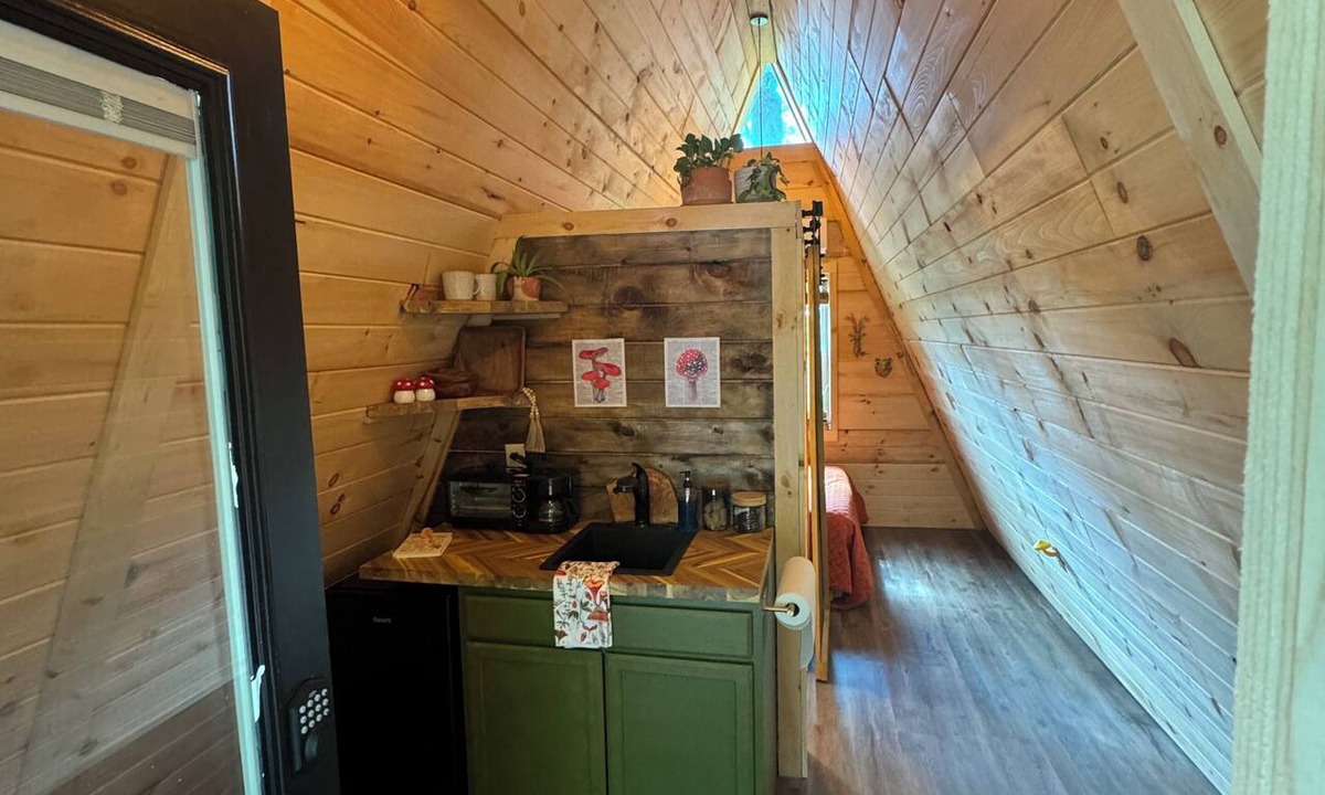 Corbin Cabin | The Naturalists is a peaceful off grid A frame cabin with an outdoor shower.