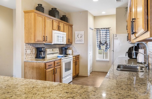Branson Condo | 2 Bedroom, 2 Bathroom Golf Condo featuring Private, Covered Balcony with Pool View