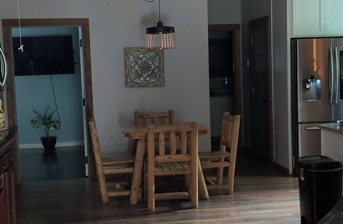 Tulsa Cabin | Beautiful lodge with hot tub nestled at the edge of the woods on gated property