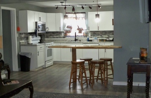 Larned Cottage | Charming 2-bedroom cottage in welcoming Larned with AC,WiFi, full over full bunk