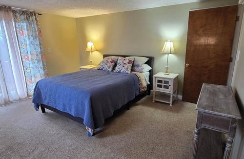 Warrensburg House | Charming 3-bedroom farmhouse with large front and back decks. Fenced in backyard