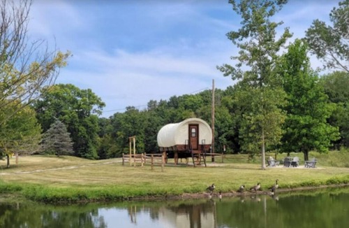 Andrew County RV Rental | Covered Western Style Wagon at AOK Campground up to 6 persons