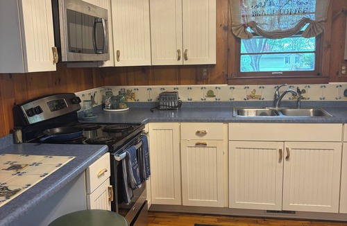 Osage Beach Cottage | Cozy wooded 2-bedroom cottage on the lake in Osage Beach