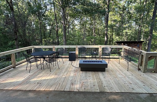 Iuka Cottage | Cozy woodland retreat with modern comforts and rustic charm.