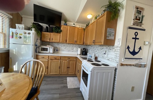 Hatteras Condo | Discover a hidden treasure at this unique, comfortable cabana Foolish Endeavor!