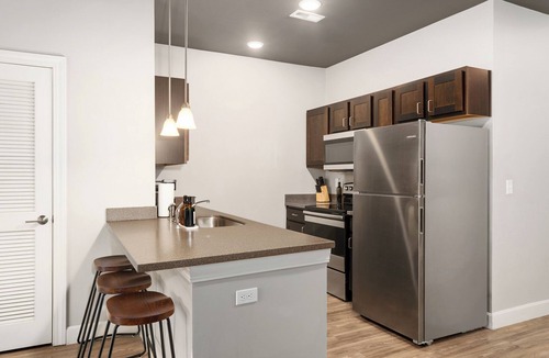 Lawrence Apartment | Downtown Lawrence Condo 1 Block to Mass St Walk to KU Hot Tub Sleeps 4
