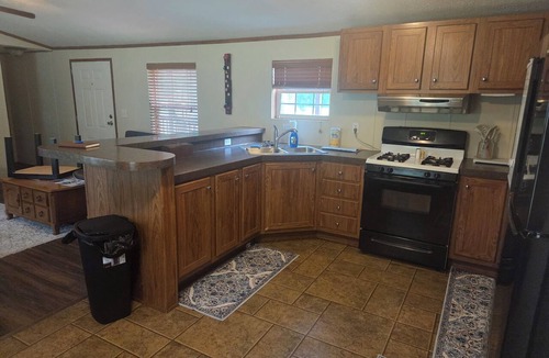 Cisne House | Enjoyable 2-bedroom mobile home with AC in charming Cisne. Quiet neighborhood.