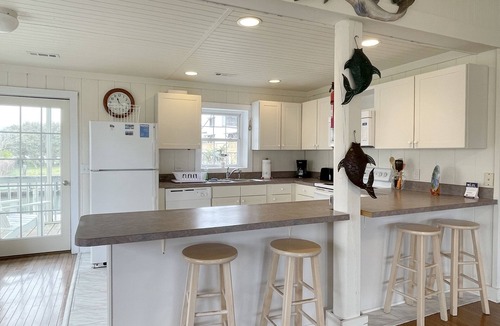 Ocracoke House | Hoi Toide Low Toide: Two homes in one. Canal front, boat docking.