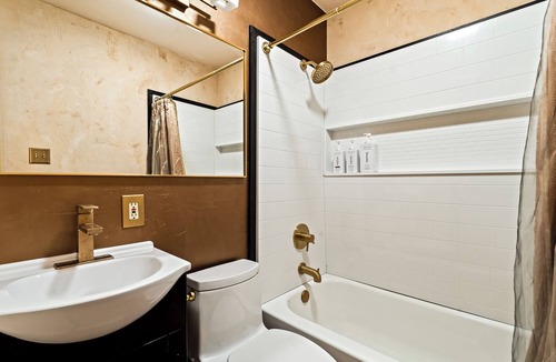 Taos Apartment | King Suite, kitchenette, private fenced patio with shared laundry and sauna on site.