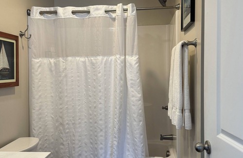 Elizabethtown Resort | Luxury Lodging, Lakefront View, King Bed w/Private Bath, Private Patio.