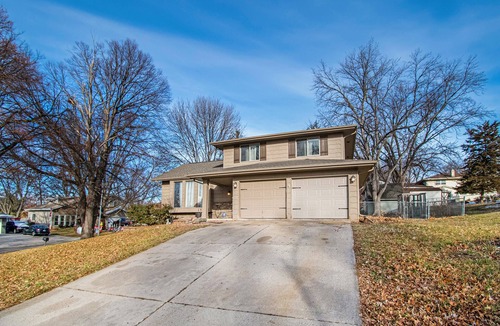 Chalco House | Modern 4BR Omaha, Fenced Yard, Desks in Every Room, W/D, Pet-Friendly