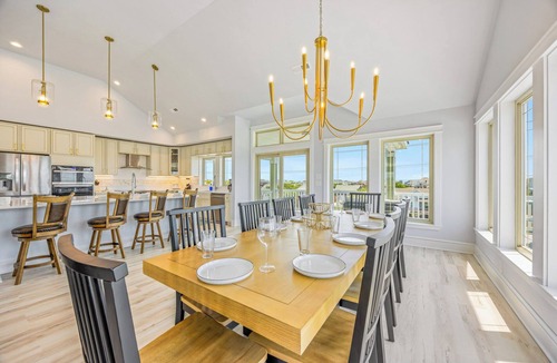 Wind Over Waves House | New Soundside Dog Friendly Avon Retreat with Pool, Hot Tub, Game Room, Theater