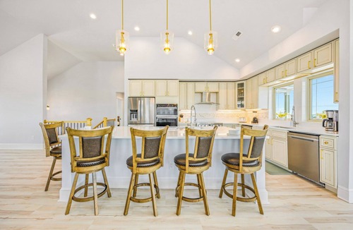 Wind Over Waves House | New Soundside Dog Friendly Avon Retreat with Pool, Hot Tub, Game Room, Theater