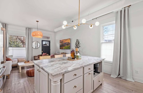 Schnitzelburg Apartment | NEW! Stylish Home w/Projector TV & Pvt Backyard!