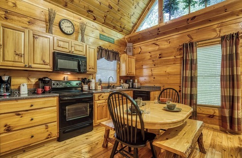 Sevierville Cabin | Private Wooded Setting! Theater Room! Centrally Located! 3 Decks! Fun Game Room