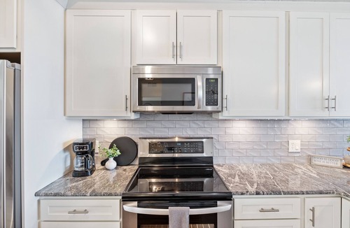Osage Beach Condo | Revitalize at Lands' End! - Main Channel View, Shaded Deck, Waterfall Pool, WiFi
