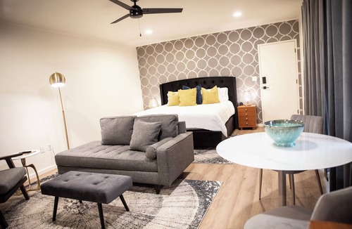 Cherokee Village Hotel | Suite 104 freatures a private outdoor-covered balcony.