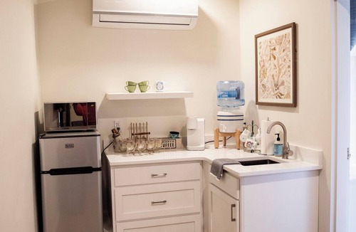 Cherokee Village Hotel | Suite 104 freatures a private outdoor-covered balcony.