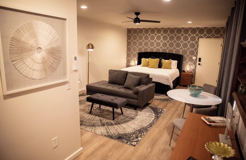Cherokee Village Hotel | Suite 104 freatures a private outdoor-covered balcony.