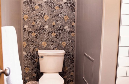 Cherokee Village Hotel | Suite 105 freatures a private outdoor-covered balcony.