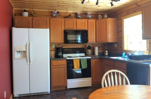 Steelville Cabin | Two-Story Log Cabin Rental with a Hot Tub near Upper Meramec River, Missouri