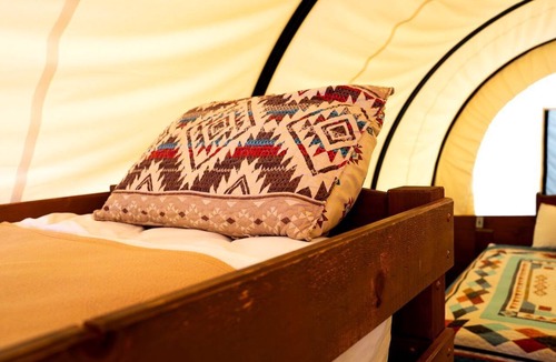 South Oklahoma City House | Unforgettable Glamping Getaways in this Covered Wagon in Moore, Oklahoma