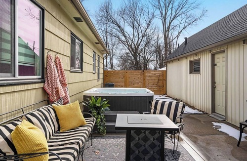 Kansas City House | Upscale comfort near Legends, KC Speedway & Sporting KC stadium. Chef's kitchen, private hot tub, & google fiber.