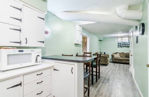 Manhattan House | Walk To Aggieville from Brick Cottage with Man Cave, Shuffle Board, Back Yard