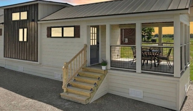 Adorable 1 bedroom tiny home w/loft situated on 156 acres in Shelbyville, TN
