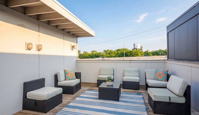 Summer rooftop deck, patio lounge, skyline views near Broadway