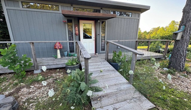 The Ridge Adventure Center rustic pet friendly tiny cabin, outdoor shower stage